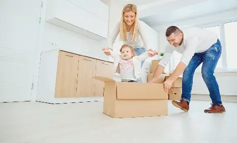 Family celebrating their new home with their kid